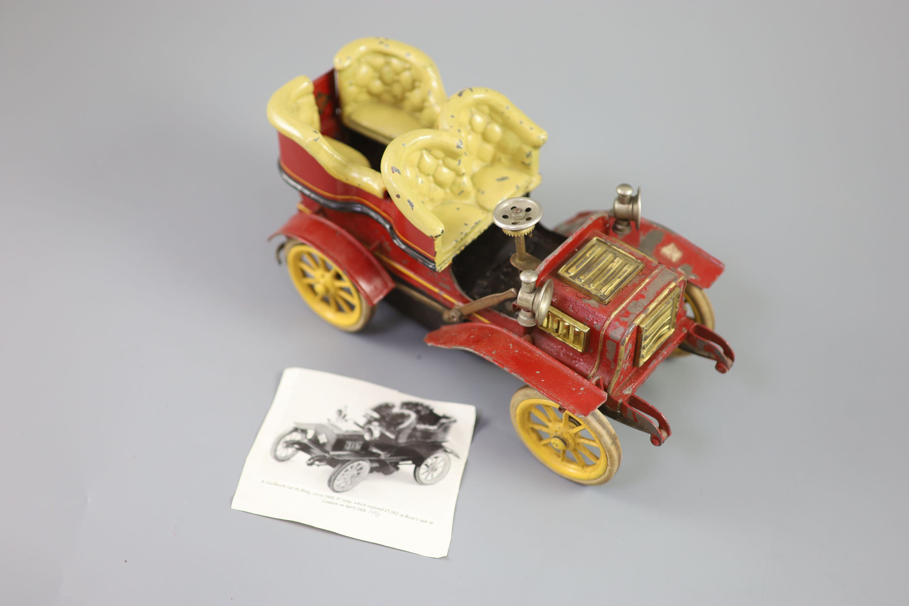 A Bing clockwork tinplate car, c.1906, length 9.5in. width 5in., with original card box and winding key
